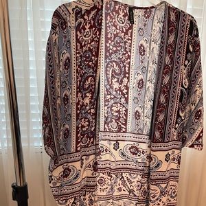 Cardigan with fringe at the bottom